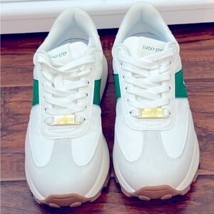 White fashion sneaker green with gum bottom
